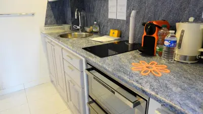 a kitchen with a sink and a counter top at Proche Croisette, Exclusivité Congres by Palmazur in Cannes