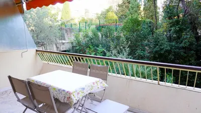 a table and chairs on a balcony with a view at Proche Croisette, Exclusivité Congres by Palmazur in Cannes