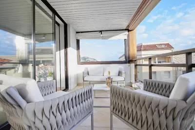 a room with two chairs and a large window at Appartement privé vue mer Cannes centre Gray d'Albion in Cannes