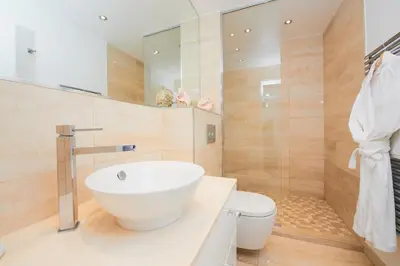a bathroom with a white sink and a toilet at Appartement privé vue mer Cannes centre Gray d'Albion in Cannes