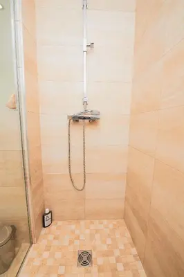 a shower with a hose in a shower stall at Appartement privé vue mer Cannes centre Gray d'Albion in Cannes