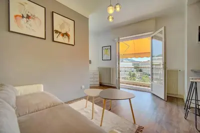 a living room with a couch and a table at Le Maria - Cannes - Renovated Feb 2025 in Cannes