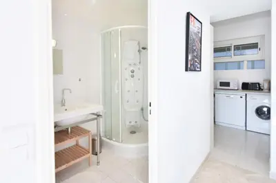 a bathroom with a shower and a sink at 1-Br Sea view Luxury Residential with pool in Cannes