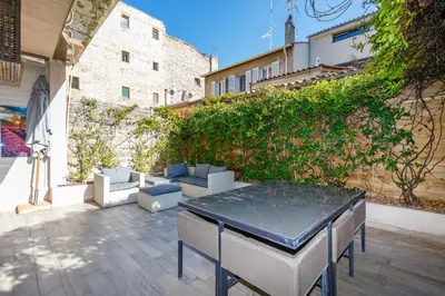 a table and chairs on a patio in a building at beautiful 3 room-flat near palais in Cannes