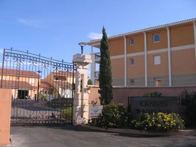 a building with a gate in front of it at Appartement duplex 6 personnes Cannes Grand Parc in Cannes