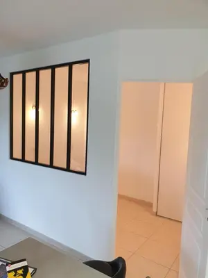 a mirror hanging on a wall in a room at Appartement duplex 6 personnes Cannes Grand Parc in Cannes
