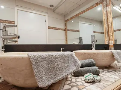 a bathroom with two sinks and a large tub at Magnifique appartement le Cannet,Cannes, Parking, Wifi in Le Cannet