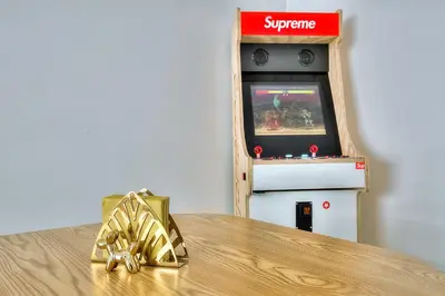 a video game console with a gold bow on a table at Luxury 4 Stars Apartment with 2 Terraces, Cannes Croisette in Cannes