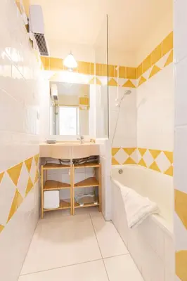 a bathroom with a sink and a tub at Villa Francia in Cannes