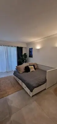 a bedroom with a large bed in a room at Le Castille - à deux pas des plages in Cannes