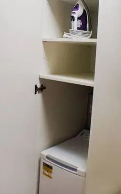 an open door to a small refrigerator in a room at Le Castille - à deux pas des plages in Cannes