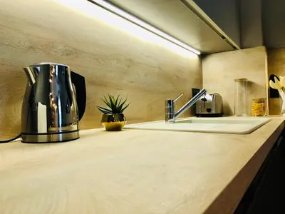 a kitchen counter with a coffee maker on it at I Cannes Sleep - Centre ville au calme in Cannes
