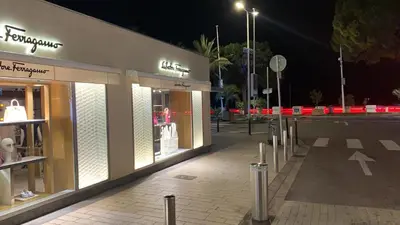 a store front of a street at night at Village Croisette in Cannes