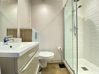 a bathroom with a toilet and a sink and a shower at Gallia Bella By SCLS Locations in Cannes