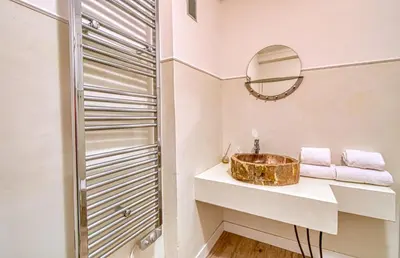 a bathroom with a sink and a mirror at Romantic and new apartment in the famous Rue Meynadier in the supercentre of Cannes in Cannes