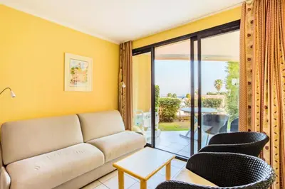 a living room with a couch and chairs at Résidence Cannes Villa Francia - maeva Home - Studio 2 Personnes Confort MAE-1845 in Cannes