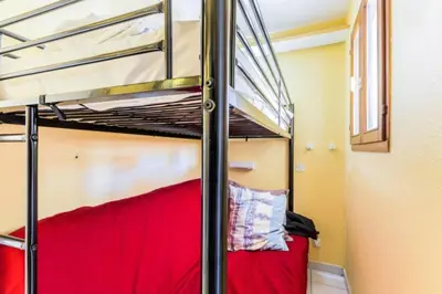 a bunk bed in a small room with a bunk bed in a bedroom at Résidence Cannes Villa Francia - maeva Home - Studio 2 Personnes Confort MAE-1845 in Cannes
