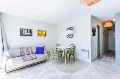 a living room with a couch and a table at Résidence Cannes Villa Francia - maeva Home - Appartement design 2 pièces 3 personnes avec vue mer - Prestige - Super Home MAE-4317 in Cannes