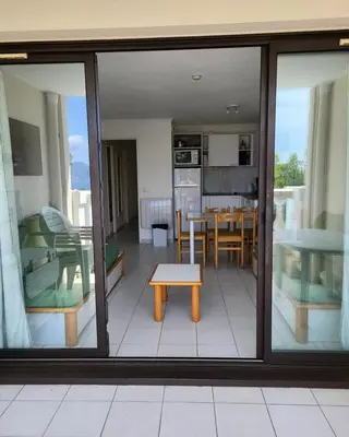 a view of a living room and kitchen from a balcony at Résidence Cannes Villa Francia - maeva Home - Appartement 3 pièces 4 personnes - Confort MAE-5666 in Cannes
