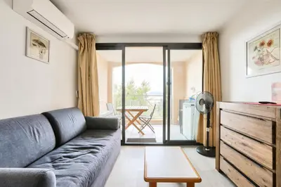 a living room with a couch and a table at Résidence Cannes Villa Francia - maeva Home - Appartement 2 pièces 4 personnes - Confort MAE-1762 in Cannes