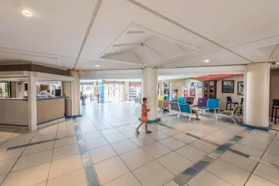 a young child walking through a lobby of a building at Résidence Cannes Verrerie - maeva Home - Studio 5 personnes Selection MAE-7337 in Cannes