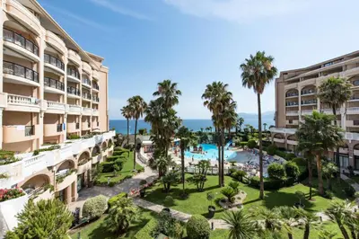 an aerial view of a resort with a pool and palm trees at Résidence Cannes Verrerie - maeva Home - Appartement 3 Pièces 6 Personnes - Selection MAE-0305 in Cannes
