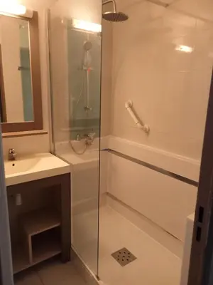 a bathroom with a glass shower and a sink at Résidence Cannes Verrerie - maeva Home - Appartement 3 Pièces 6 Personnes - Selection MAE-0305 in Cannes