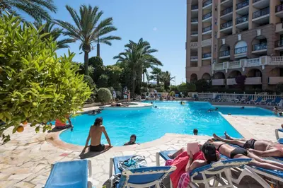 a group of people in a swimming pool at a hotel at Résidence Cannes Verrerie - maeva Home - Appartement 3 Pièces 6 Personnes - Sélection MAE-4213 in Cannes