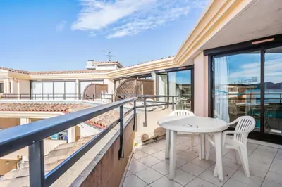 a balcony with a white table and chairs at Résidence Cannes Verrerie - maeva Home - Appartement 3 Pièces 6 Personnes - Sélection MAE-4213 in Cannes