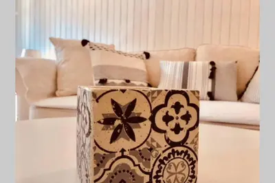a box sitting on a table in a living room at Cannes 78 rue meynadier plage, Mipim Festival 3 minutes à pieds in Cannes