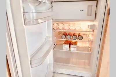 an open refrigerator with food inside of it at Cannes 78 rue meynadier plage, Mipim Festival 3 minutes à pieds in Cannes