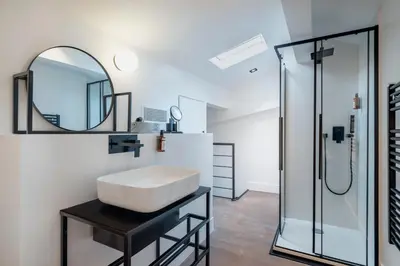 a bathroom with a sink and a mirror at RESIDENCE MONTEFIORE in Cannes