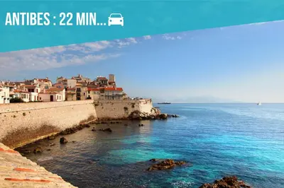 a view of a beach with buildings and the ocean at 4P Modern & Secured Parking in Le Cannet