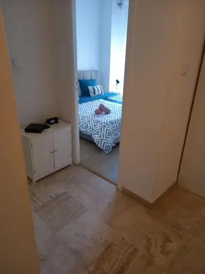 a small bedroom with a bed and a mirror at ++++ renovated cosy 50m2 sunny flat / balcony / close to beach and to the Palais des festivals ++++ in Cannes