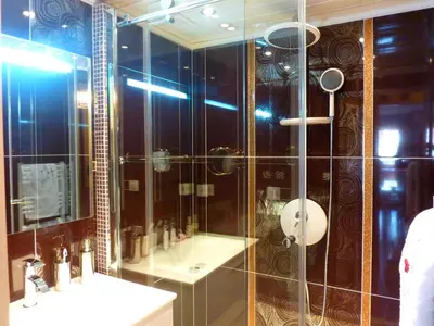 a bathroom with a glass shower and a sink at Cannes Center in Cannes