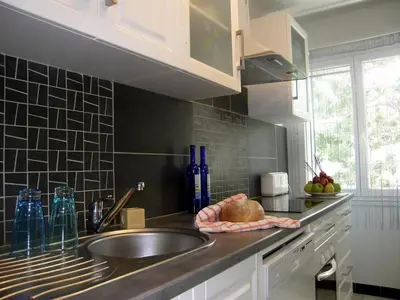 a kitchen with a sink and a counter top at Cannes Plage in Cannes