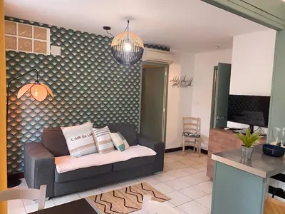 a living room with a couch and a table at Cannes Plage in Cannes
