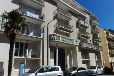two cars parked in front of a building with balconies at Palazzio 2, by Welcome to Cannes in Cannes