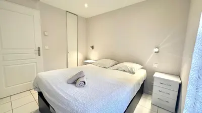 a bedroom with a bed with a white bedspread at Palazzio 2, by Welcome to Cannes in Cannes