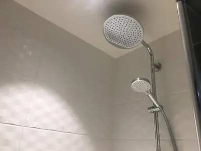 a shower with a shower head in a bathroom at Bleu Regard in Cannes