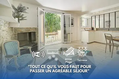 a kitchen with a living room with a fireplace at Le Alex - 800m des plages - extérieur - Verrière Côte d'Azur in Cannes