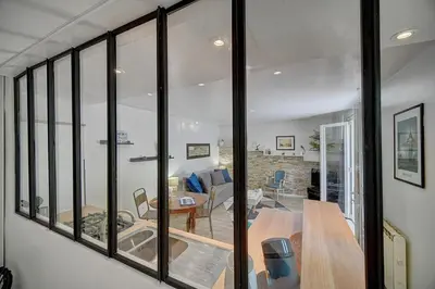a living room with glass windows and a dining room at Le Alex - 800m des plages - extérieur - Verrière Côte d'Azur in Cannes