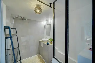 a bathroom with a shower and a toilet and a ladder at Le Alex - 800m des plages - extérieur - Verrière Côte d'Azur in Cannes