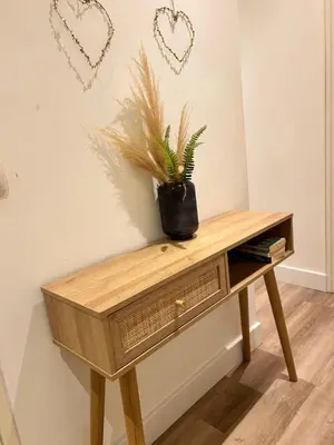 a wooden table with a plant sitting on top of it at 2P 40m2 -Cannes centre- Palais des festivals - in Cannes