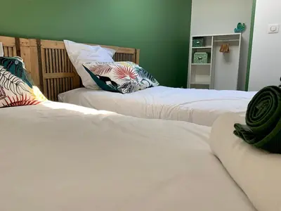 two beds sitting next to each other in a bedroom at Maison de village Cannes Le Suquet in Cannes
