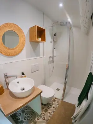 a bathroom with a sink and a shower at Maison de village Cannes Le Suquet in Cannes