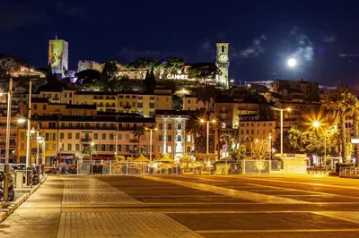 a city street at night with buildings and lights at Maison de village Cannes Le Suquet in Cannes