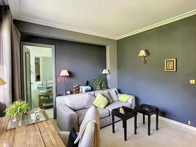 a living room with a couch and a table at FRGK 