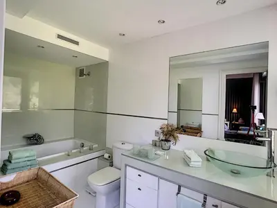 a bathroom with a sink and a toilet and a mirror at FRGK 
