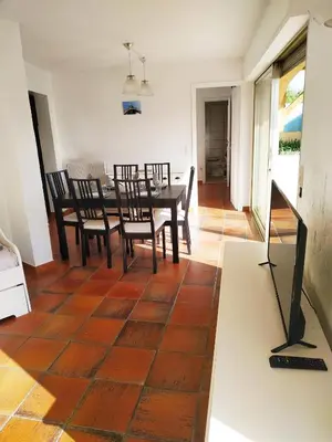 a dining room with a table and chairs at Rez-de-villa Mougins in Mougins